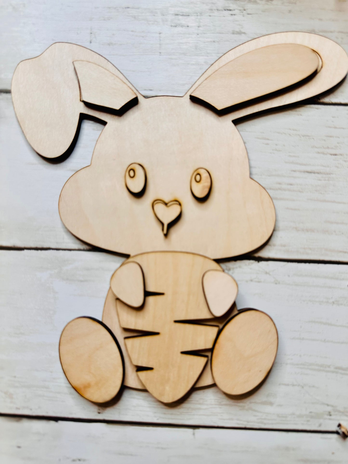 Easter bunny holding carrot